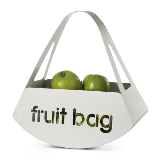 Vista di tre quarti del centro tavola Fruit Bag finitura bianco marmo con mele verdi di Arti&Mestieri.