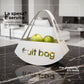 Foto ambientata del cento tavola Fruit Bag, su piano di marmo nero in cucina di Arti e Mestieri.