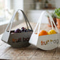 Foto ambientata del centro tavola Fruit Bag, bianco marmo e fango,  di Arti e Mestieri.